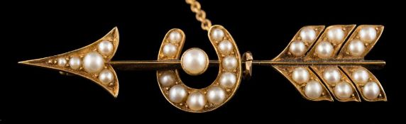 A Victorian seed pearl mounted bar brooch: in the form of an arrow with horseshoe with attached