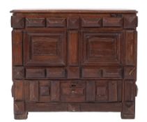 A 17th Century Continental oak rectangular coffer:, of small size, with a hinged moulded top,