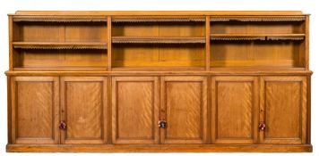 A Victorian satin birch low cabinet bookcase:, the upper part with a ledge gallery,