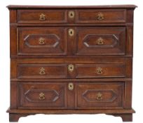 A 17th Century oak rectangular chest:, the top with a moulded edge,