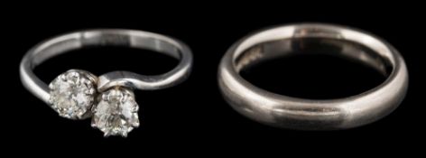 A diamond two-stone cross-over ring: set with round old,