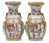 A pair of Canton porcelain vases: of oviform with raised in-scrolling neck and elephant mask