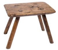 A 19th Century elm and ash rectangular milking stool:, on four splayed legs,