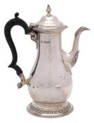 A Victorian silver coffee pot, maker Charles Stuart Harris, London, 1898: of baluster form,