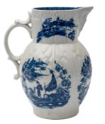 A Caughly blue and white cabbage leaf jug: with mask head spout and double scroll handle,