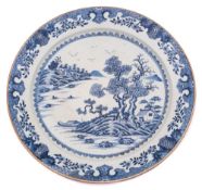 A large Chinese Export blue and white charger and a similar smaller charger: the larger painted