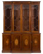A 19th Century mahogany and inlaid breakfront library bookcase:,