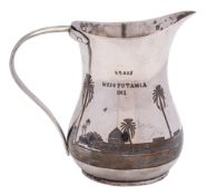 A Middle Eastern silver and niello cream jug: of baluster form,