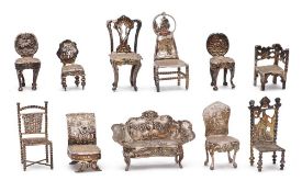 A collection of Dutch silver miniature furniture,