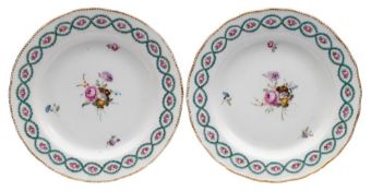 A pair of Derby plates: each finely painted in the manner of Edward Withers with a floral spray and