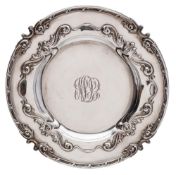 An American sterling silver charger, stamped Sterling, Howard & Co,