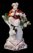 A Plymouth porcelain figure of a musician: playing a recorder and wearing a plumed hat,