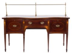 A 19th Century mahogany and inlaid serpentine fronted sideboard:, bordered with boxwood lines,