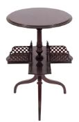 An Edwardian rosewood book table:, with a circular moulded top and quatreform revolving undertier,