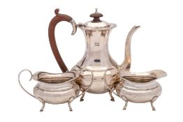 A George V silver three-piece bachelor's tea service, maker Hukin & Heath Ltd, Birmingham,
