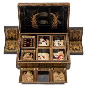 A Cantonese export gilt lacquer games box: the lift-off lid enclosing four lidded boxes and eight