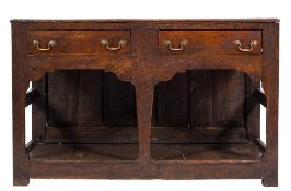 An 18th Century oak rectangular dresser base:, the top with a moulded edge,