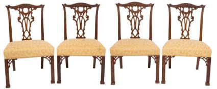 A set of six 19th Century carved mahogany dining chairs in the Chippendale taste:,