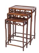A nest of three Chinese Hua Li wood rectangular occasional tables:,