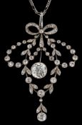 A Belle Epoque diamond mounted, open work pendant: the suspended principal diamond measures 8.