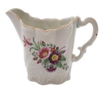 A First Period Worcester 'High Chelsea Ewer' cream jug: with leaf moulded wrythen body and painted