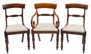 A set of seven early 19th Century mahogany dining chairs:,