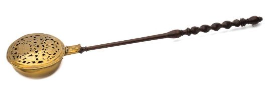 An early 18th century brass bed warming pan: possibly Dutch,
