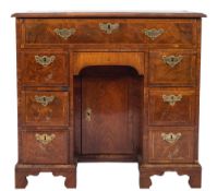 An early 18th Century walnut and cross and feather banded secretaire kneehole desk:,