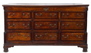 A late 18th Century oak and mahogany crossbanded mule chest:, with a rectangular hinged top,