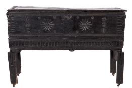 An 18th Century oak rectangular plank coffer:, with a hinged channel moulded top,