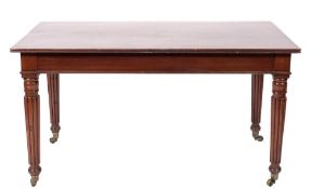 An early 19th Century mahogany rectangular library table:, the top with a reeded edge,