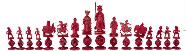 A Cantonese carved ivory Mandarin part chess set: one side stained red, the other left natural,