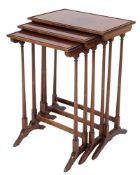 A nest of three mahogany occasional tables in the Regency taste:,