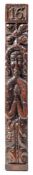 A 17th Century carved oak stile: with low relief carved caryatid figure below a stylised flowerhead