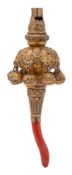 A 19th century gilt metal baby's rattle: with whistle mouthpiece and red coral teether,