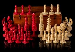 A late 19th/early 20th century ivory chess set: one side stained red, the other left natural,