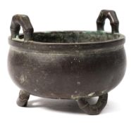 A Chinese bronze censer: of circular outline with simulated bamboo loop carrying handle with three