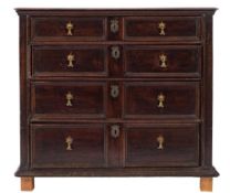 A 17th Century oak rectangular chest:, the top with a moulded edge,