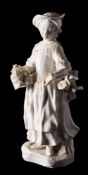 A Bristol [Richard Champion] white glazed figure of Matrimony: the girl holding a bird cage in her