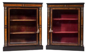A matched pair of Victorian ebonised, walnut, inlaid and gilt metal mounted pier cabinets:,