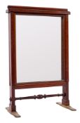 An Edwardian mahogany firescreen in the manner of Gillows:,