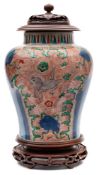A Chinese wucai baluster jar: painted with horses,