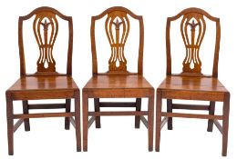 A set of six 19th Century oak dining chairs in the Country Hepplewhite taste:,