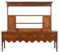 An 18th Century oak dresser base:, with associated shelved superstructure,