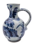 A Japanese Arita baluster jug: with loop handle pierced for mounting,