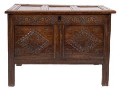 A late 17th Century carved oak rectangular coffer:, with a plain triple moulded panel hinged top,