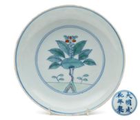 A Chinese doucai saucer dish: the interior painted with a medallion enclosing a pomegranate tree