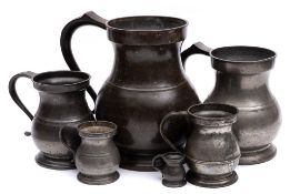 A matched set of graduated pewter measures: various makers and ages,