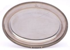 An Old Sheffield plate serving dish: crested, of oval form with gadrooned border, 39cm wide.