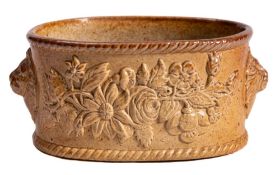 A Brampton brown saltglazed stoneware oval potted-meat dish: applied with floral and lion mask